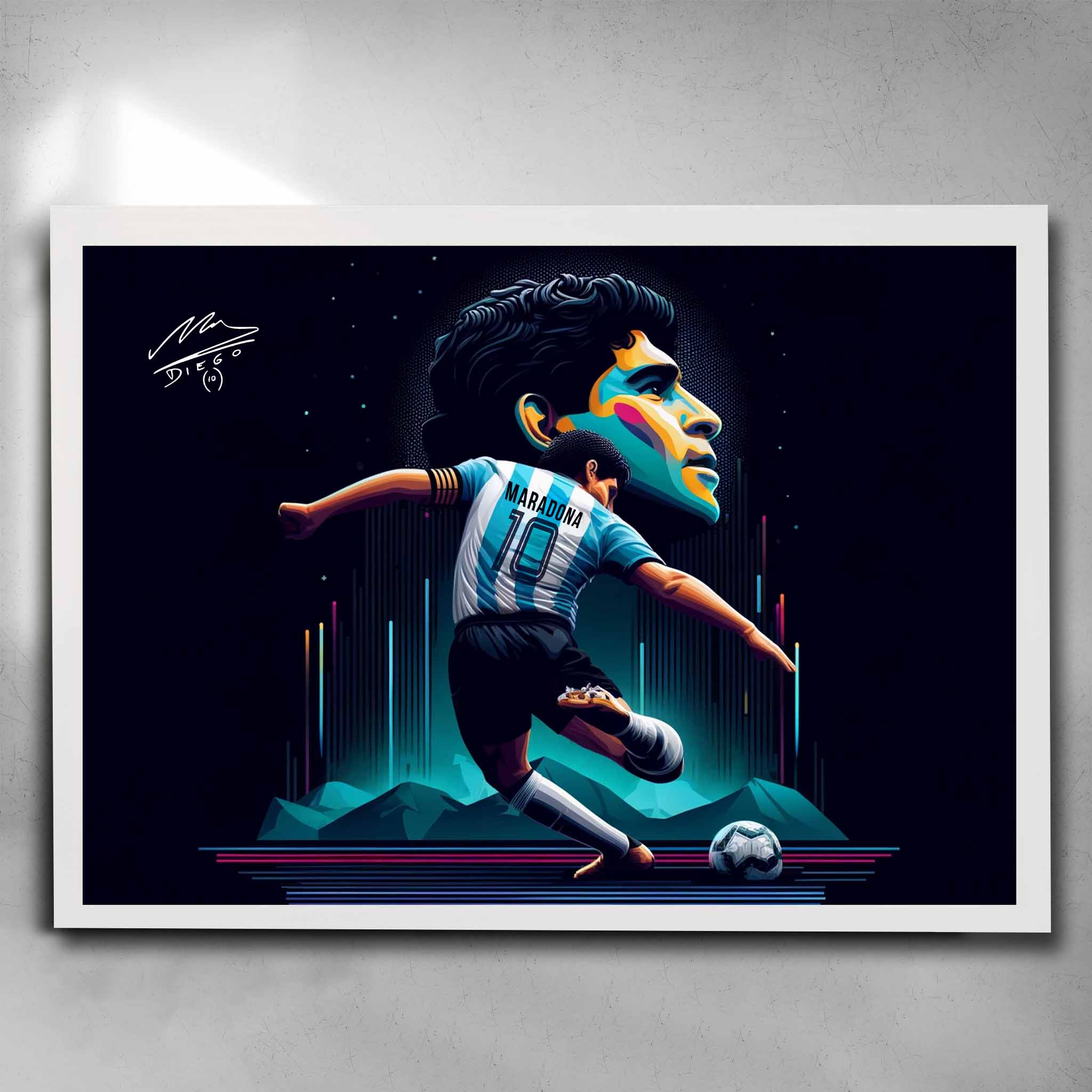 White framed soccer art featuring a signed print of the legendary Diego Maradona playing for Argentina - Artwork by Sports Cave.