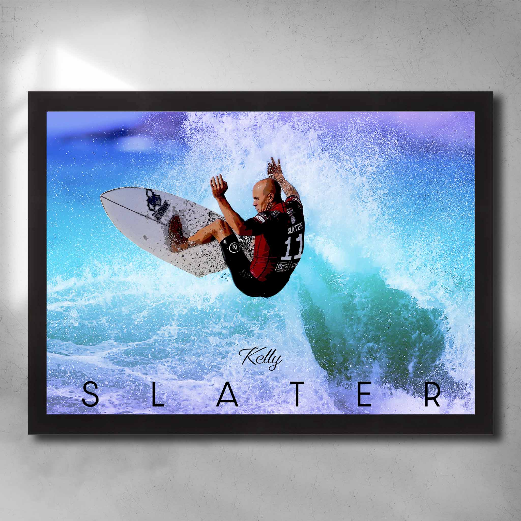 Black framed surfing art by Sports Cave, featuring the legend Kelly Slater riding a wave.