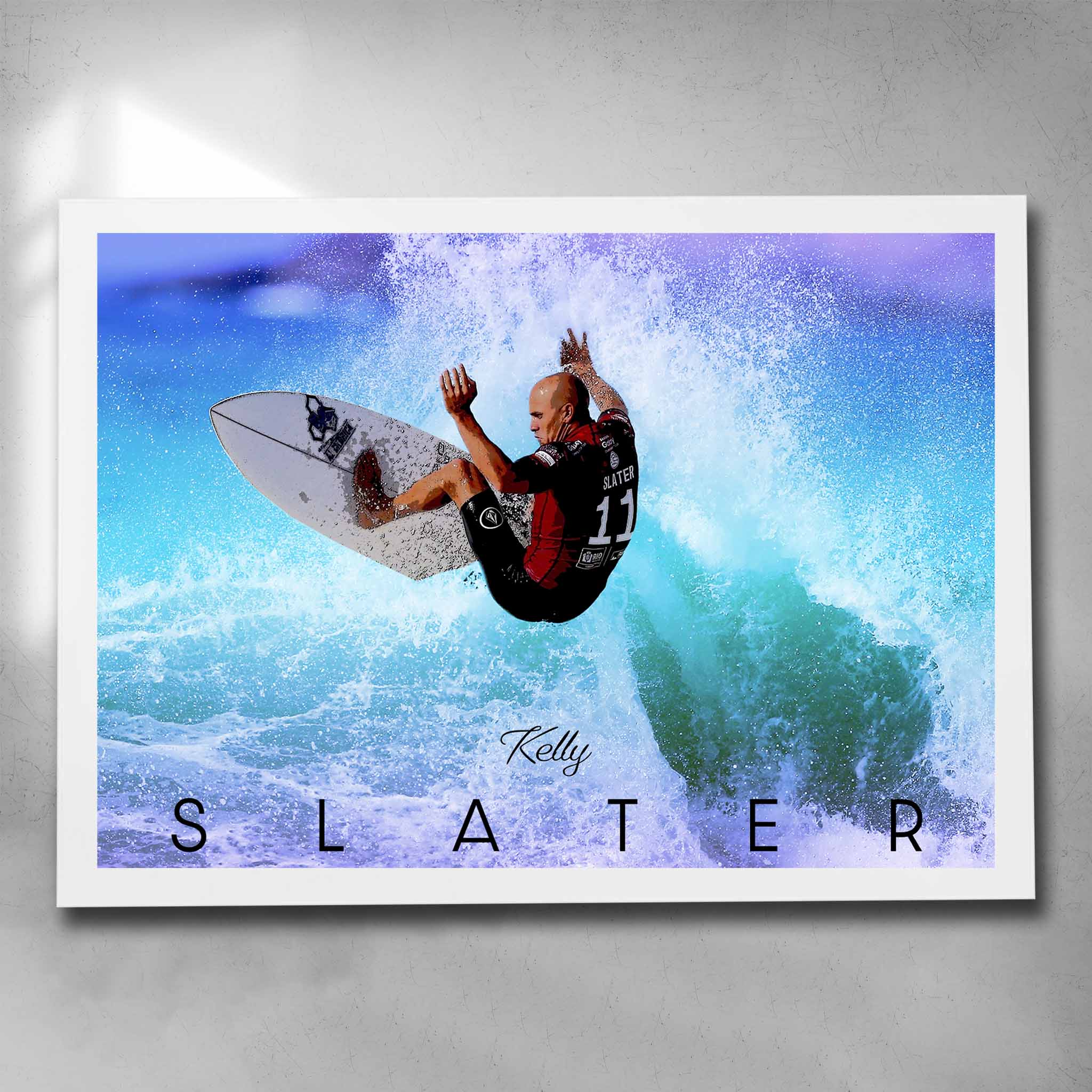 White framed surfing art by Sports Cave, featuring the legend Kelly Slater riding a wave.