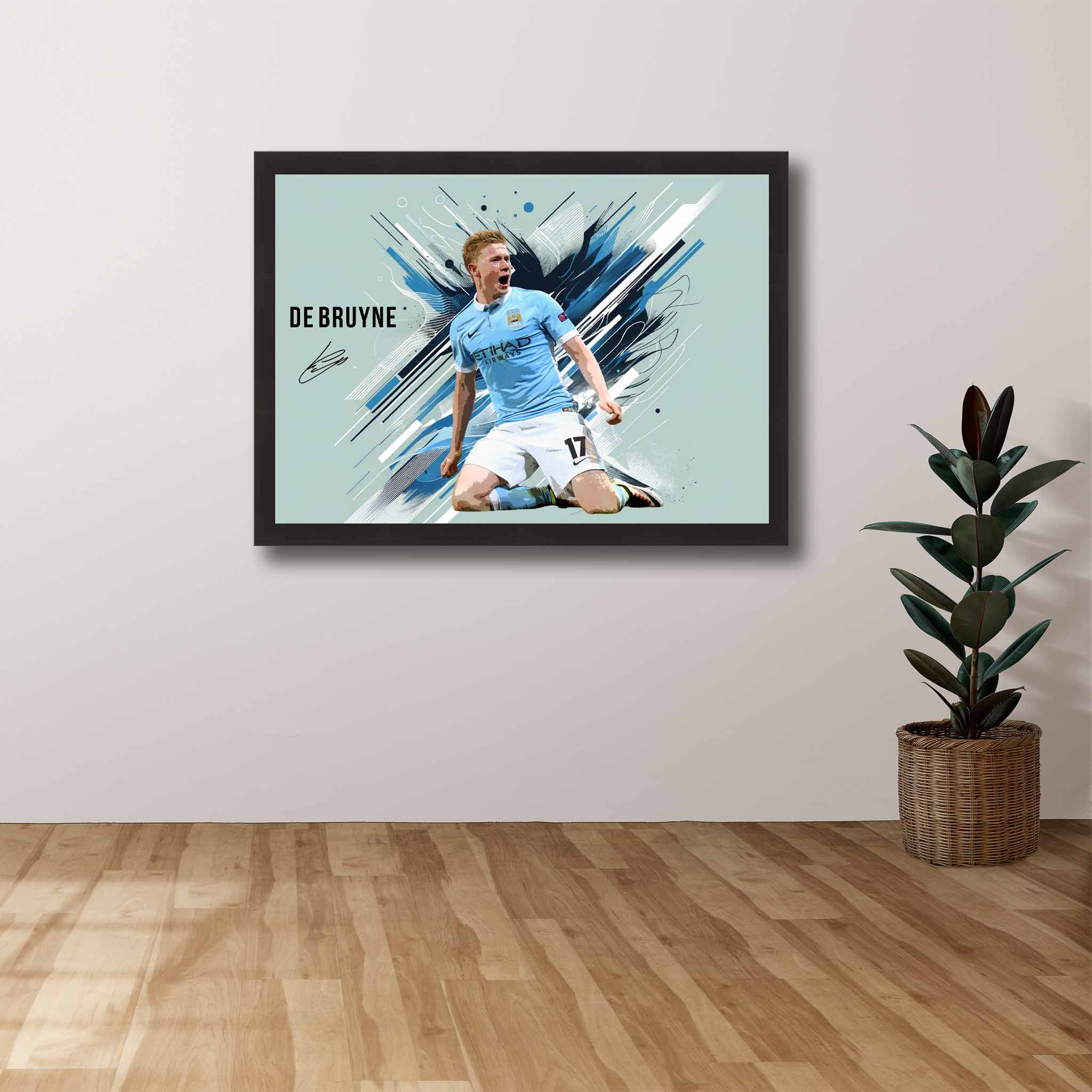 Framed art of Kevin Debruyne from Manchester City displayed on a wall. 