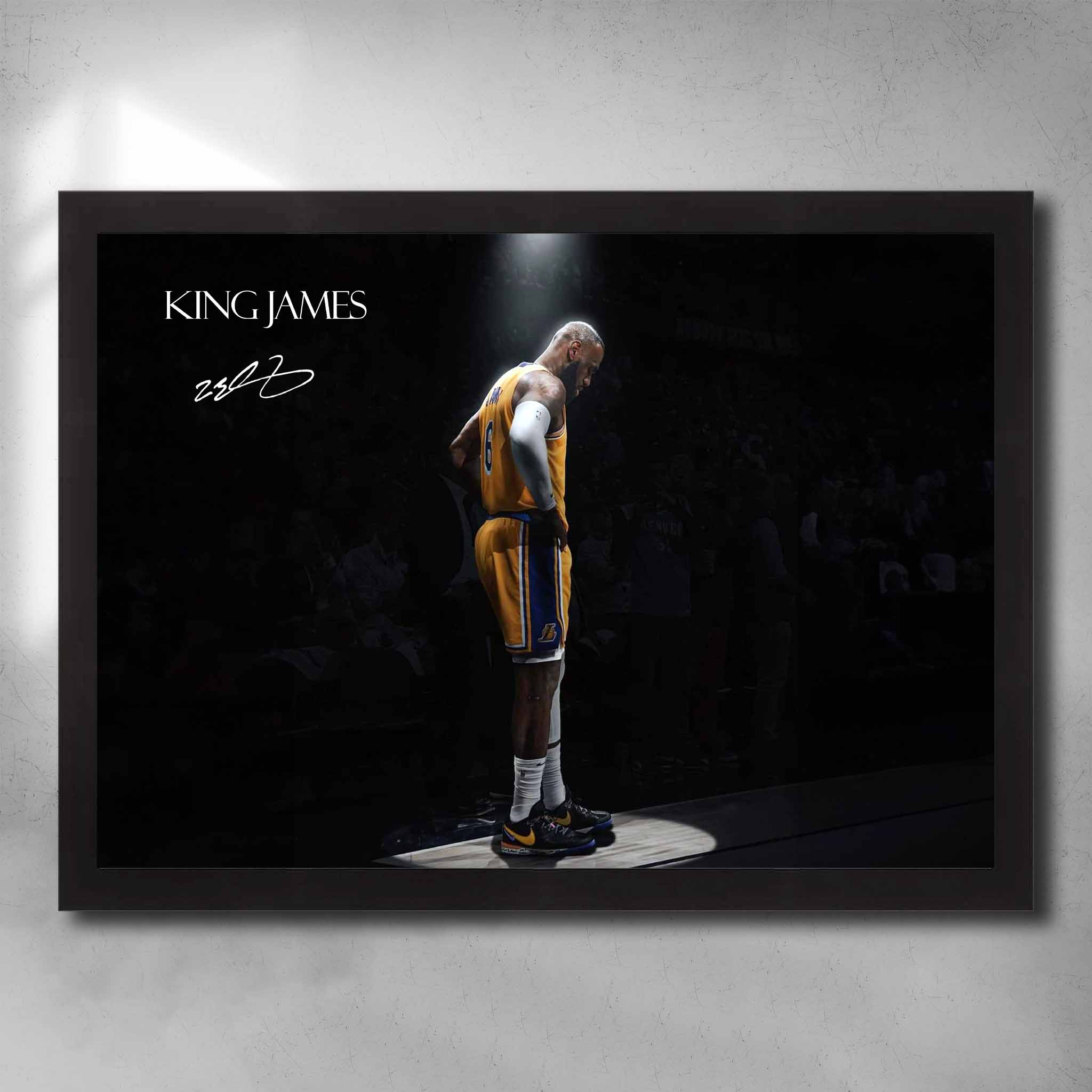 Black-framed King James art by Sports Cave, showcasing the legendary basketball icon spotlighted against a blurred audience background.