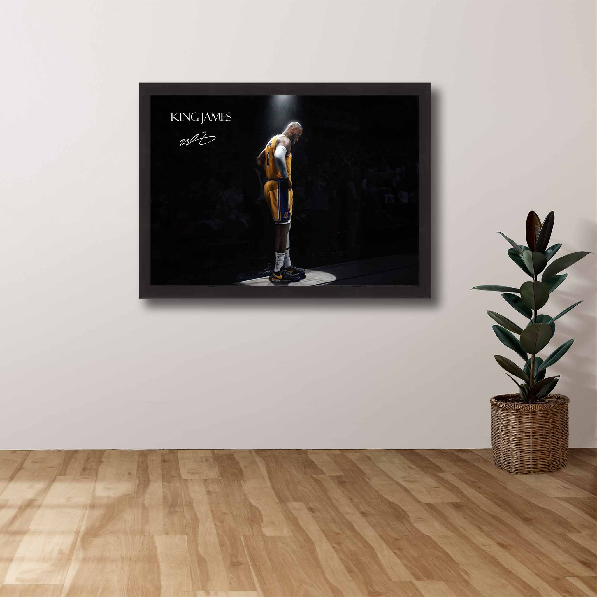 King James Tribute Art Poster by Sports Cave, mounted in a black frame on a fan's wall, highlighting the basketball legend in a dynamic spotlight.