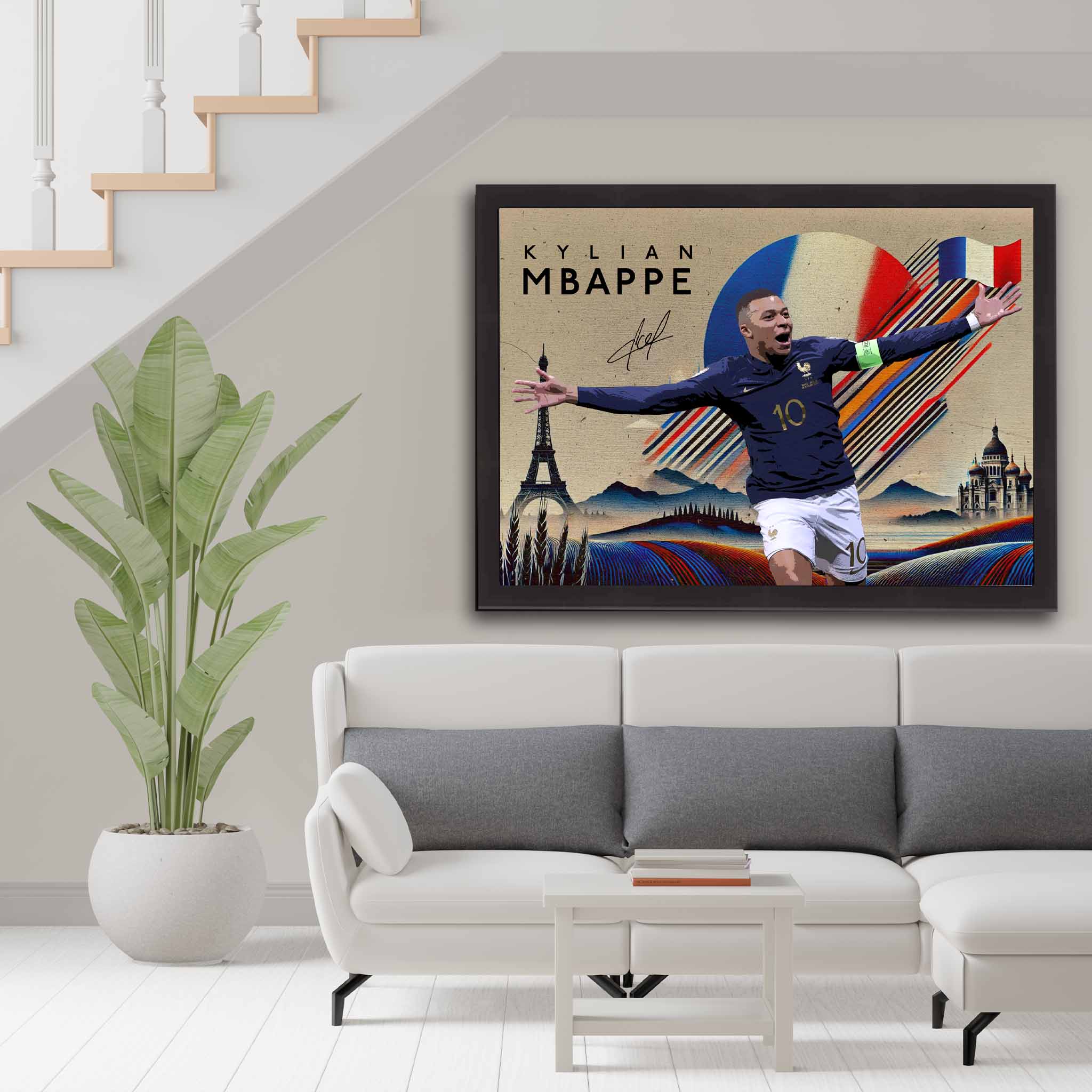 Soccer fan with a framed print of Kylian Mbappe used as home decor.