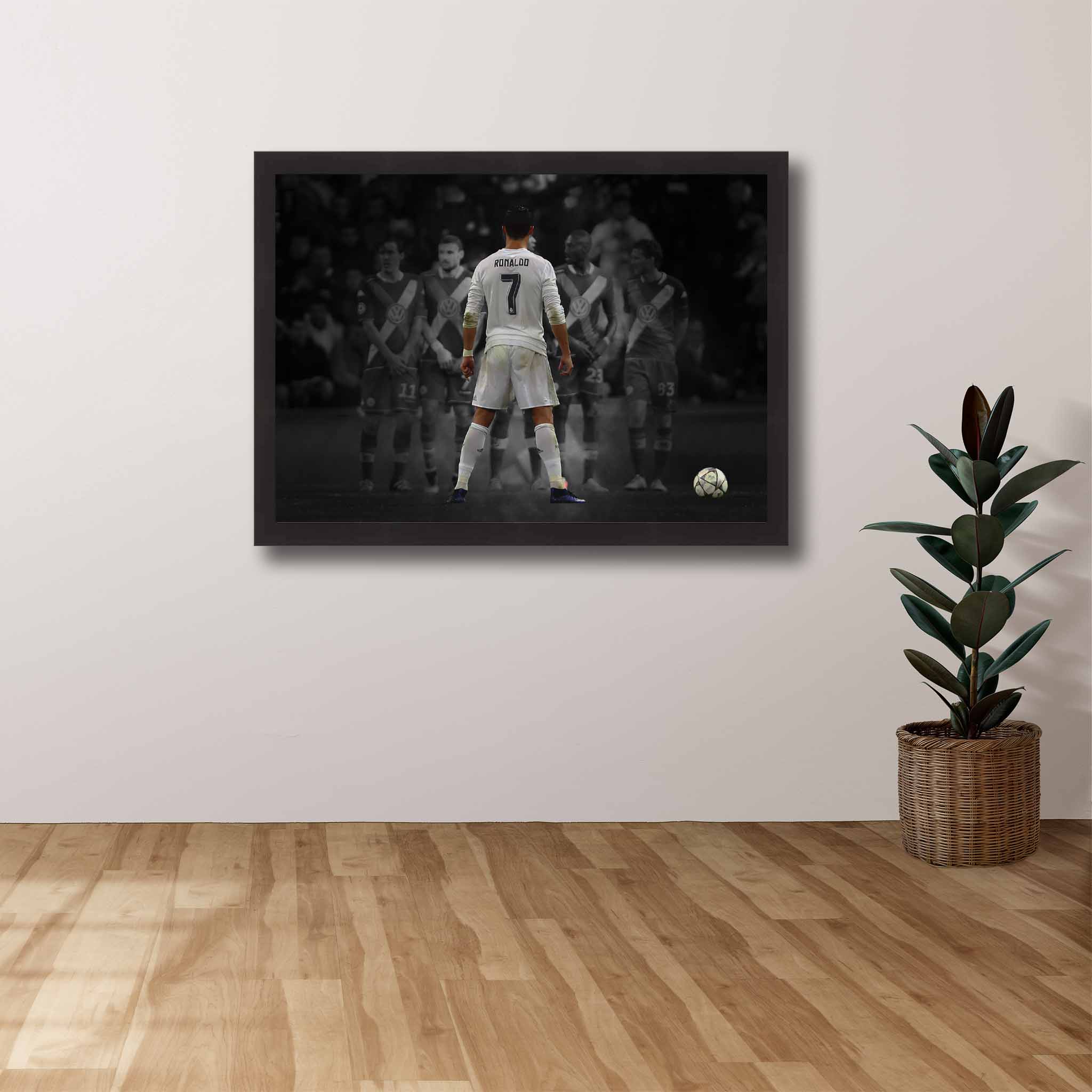 Soccer Die-hard Supporters House, featuring a framed print of Cristiano Ronaldo free kick showcased on the wall.