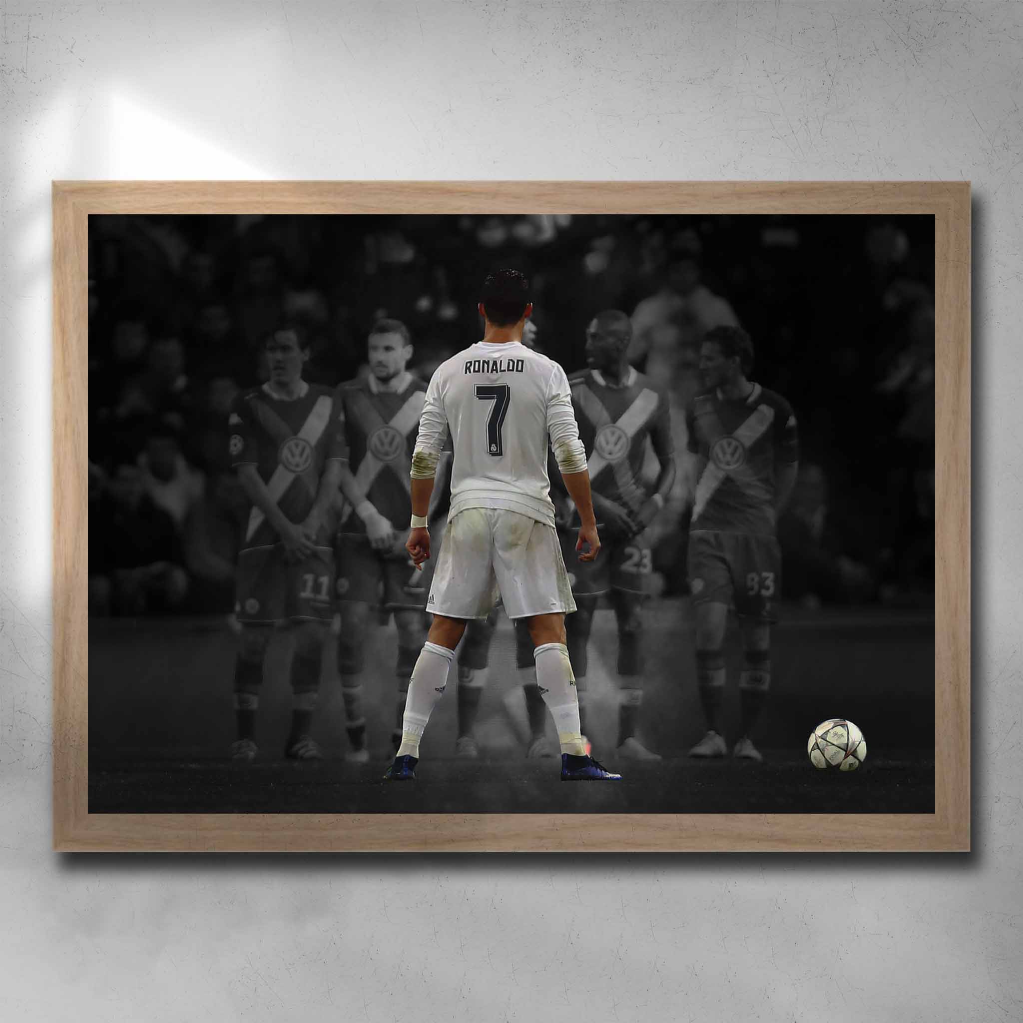 Oak framed soccer art by Sports Cave, featuring Cristiano Ronaldo taking a free kick.