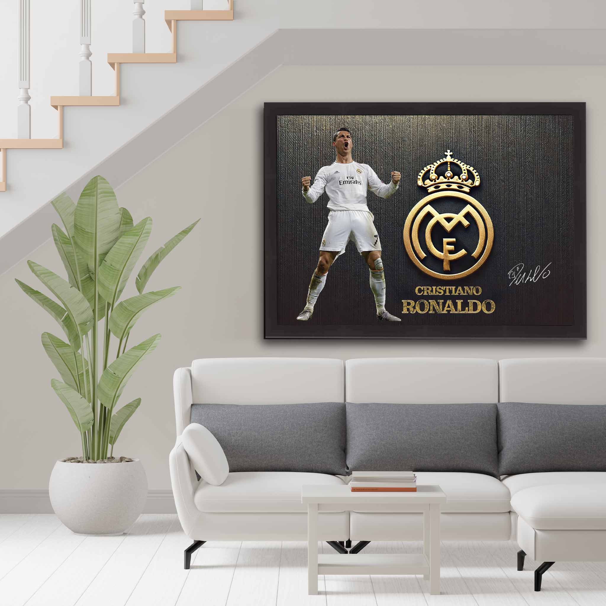 Cristiano Ronaldo framed art print featuring Real Madrid crest, elegantly displayed in a modern living room setup. Perfect for football fans' home decor.