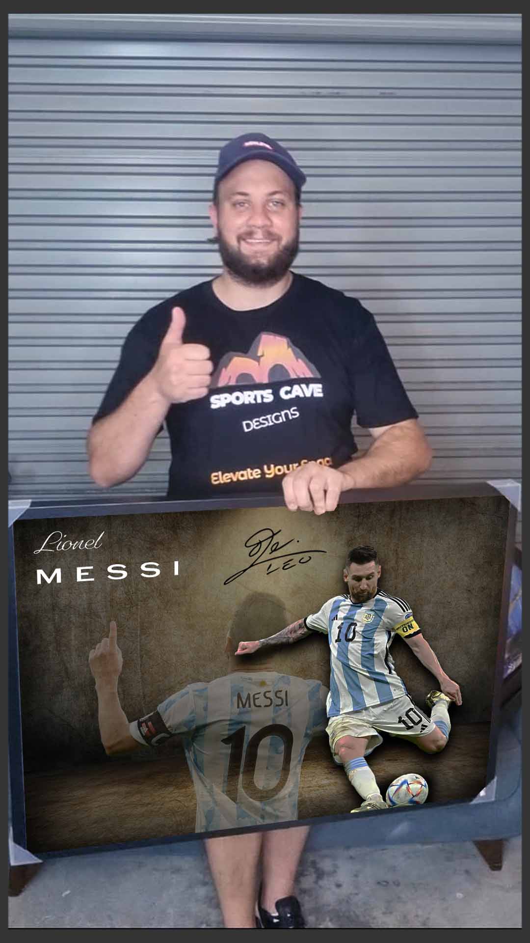 Nathan from Sports Cave holding Lionel Messi Framed Art.