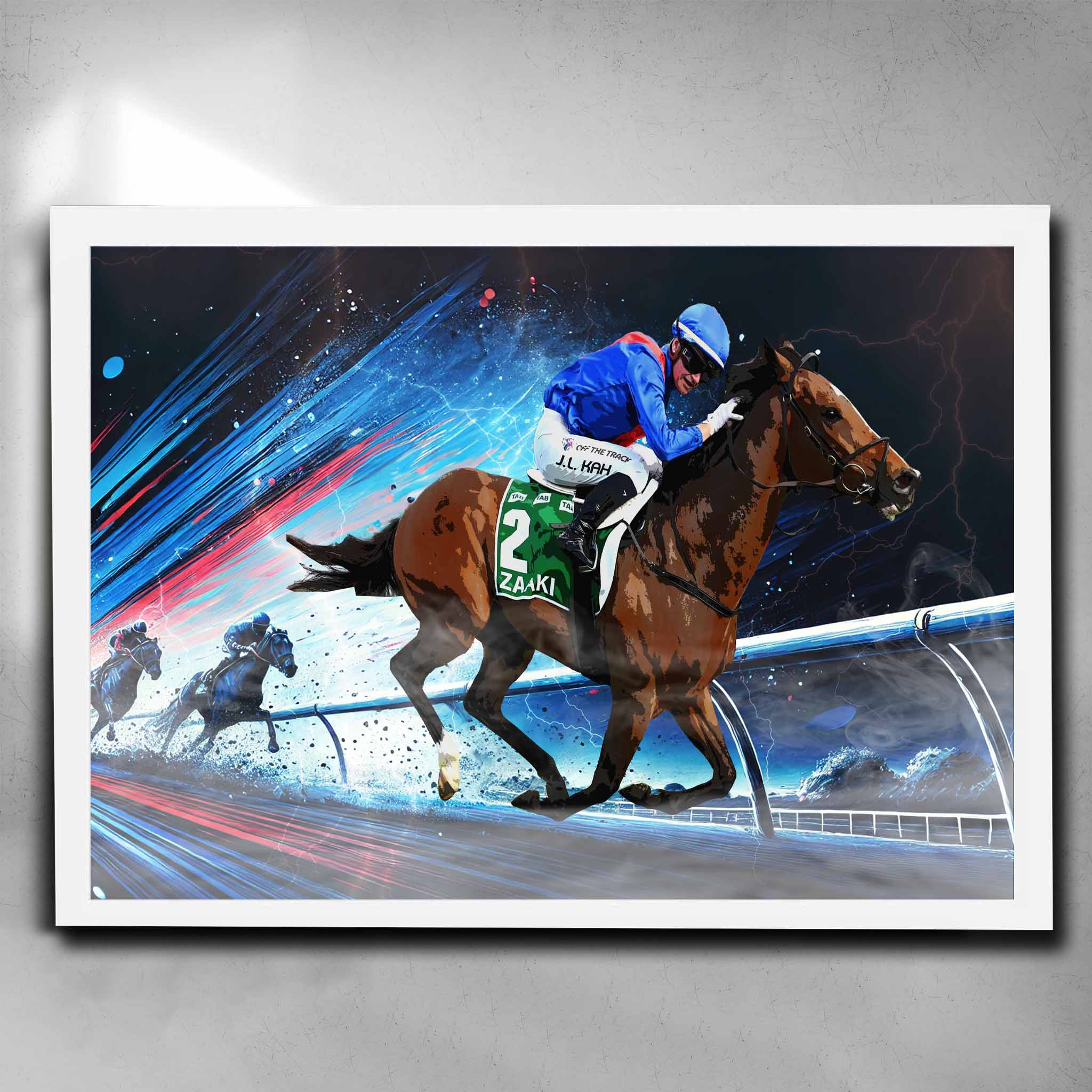 Zaaki horse racing art white framed poster with Jamie Kah in blue and red silks, capturing dynamic mid-race action. Ideal for horse racing fans and man cave decor.