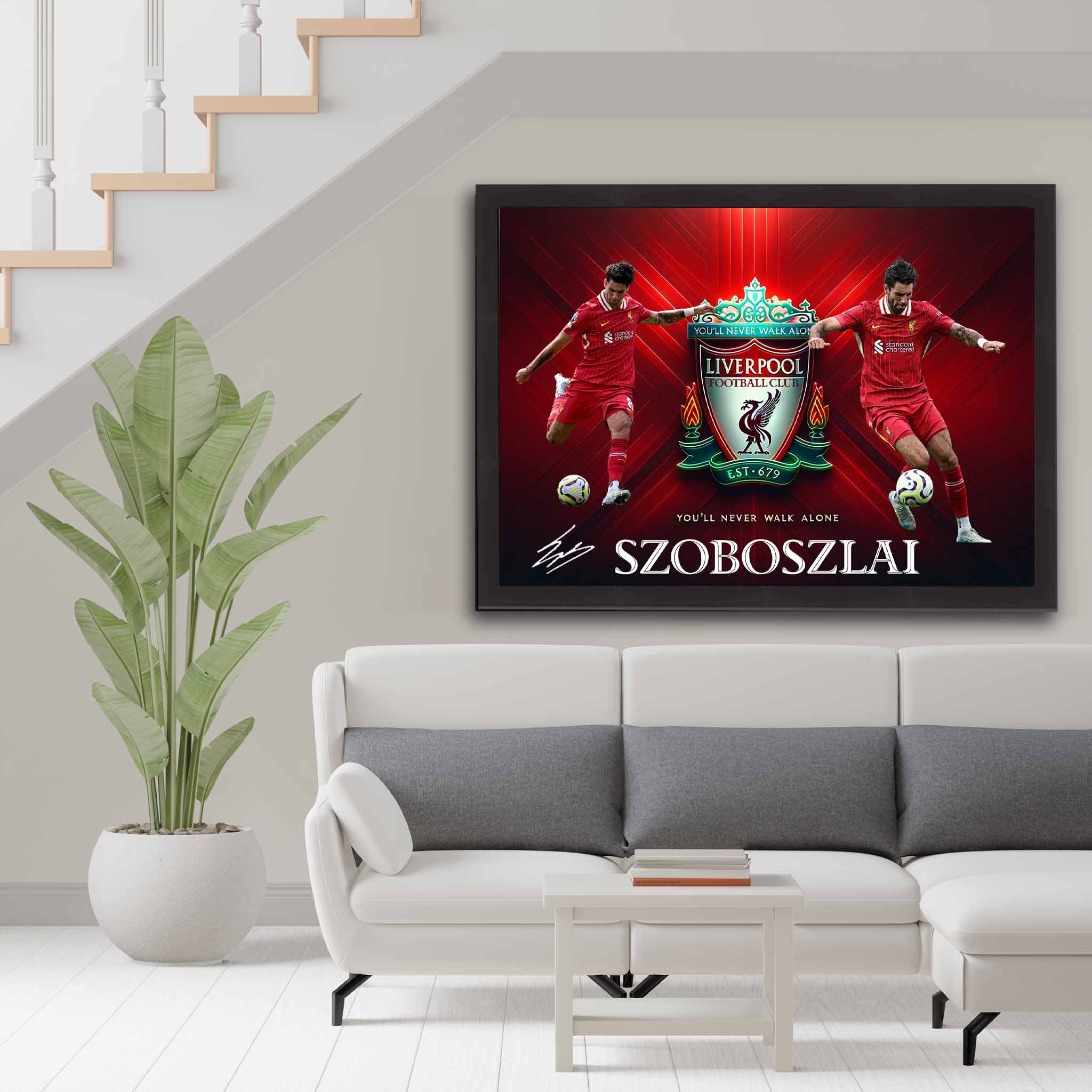 Dominik Szoboszlai Liverpool FC poster framed in black, displayed in a modern living room setup, featuring dynamic player shots and club crest.